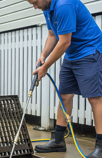 Plumber Pressure Washing Grate